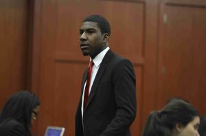 Families testify on who they hear in 911 call