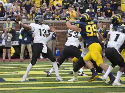 Justin Holman suffers injury as UCF fall to Michigan in The Big House