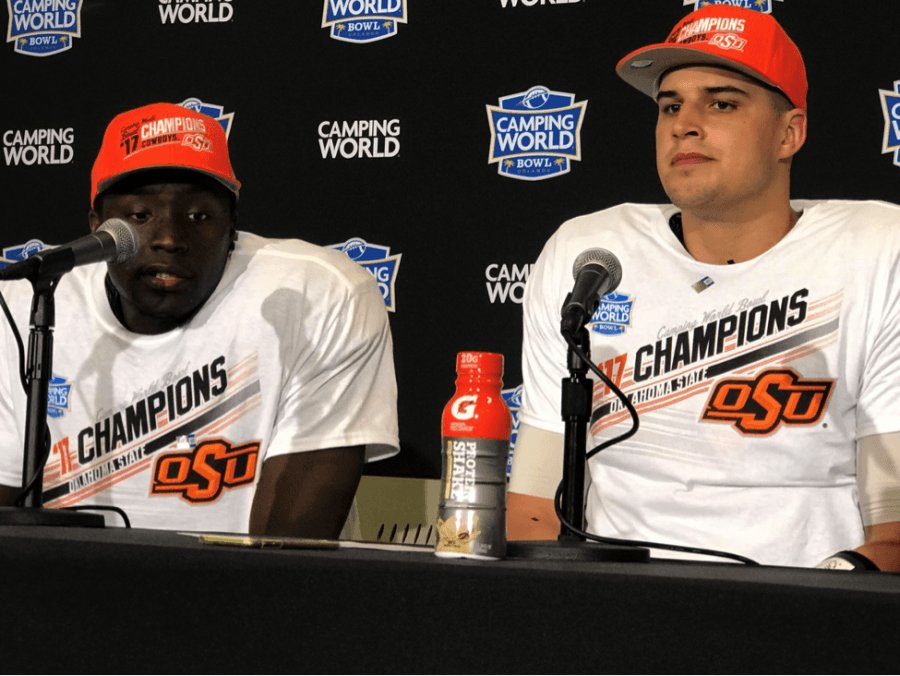Oklahoma+State%E2%80%99s+James+Washington+Jr.+%28left%29+and+2017+Camping+World+Bowl+most+valuable+player+Mason+Rudolph+%28right%29+speak+to+the+media+about+the+next+stage+of+their+careers.
